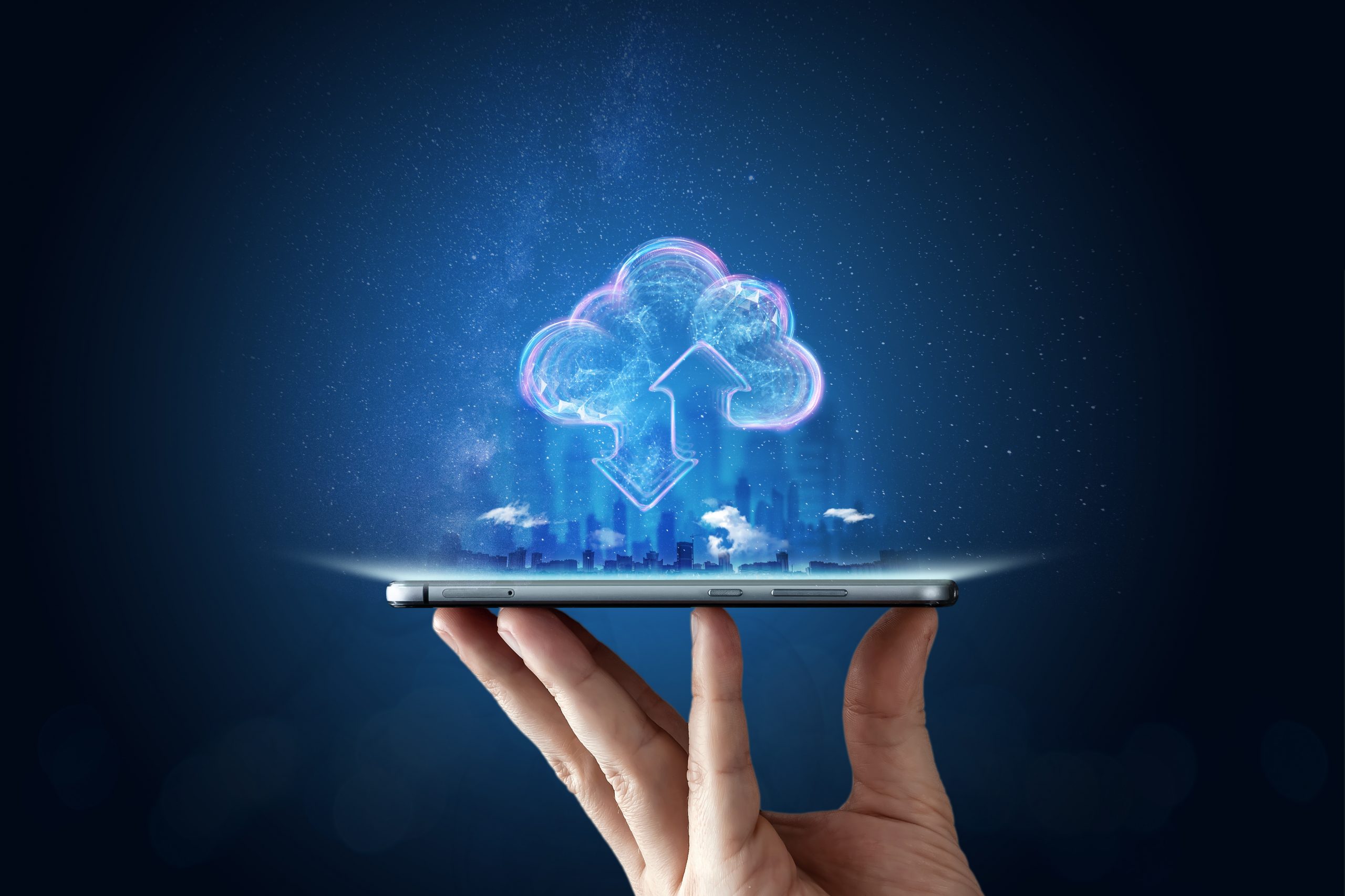 Creative background, male hand with the phone, the image of the hologram of the cloud, blue background. The concept of cloud technology, cloud storage, a new generation of networks. Mixed media.